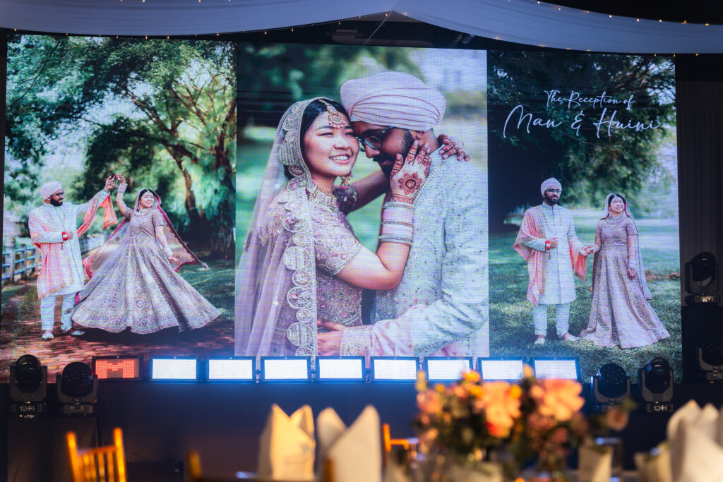 emhub wedding catering event featuring mixed race couple smiling brightly in VCR by iDoCatering