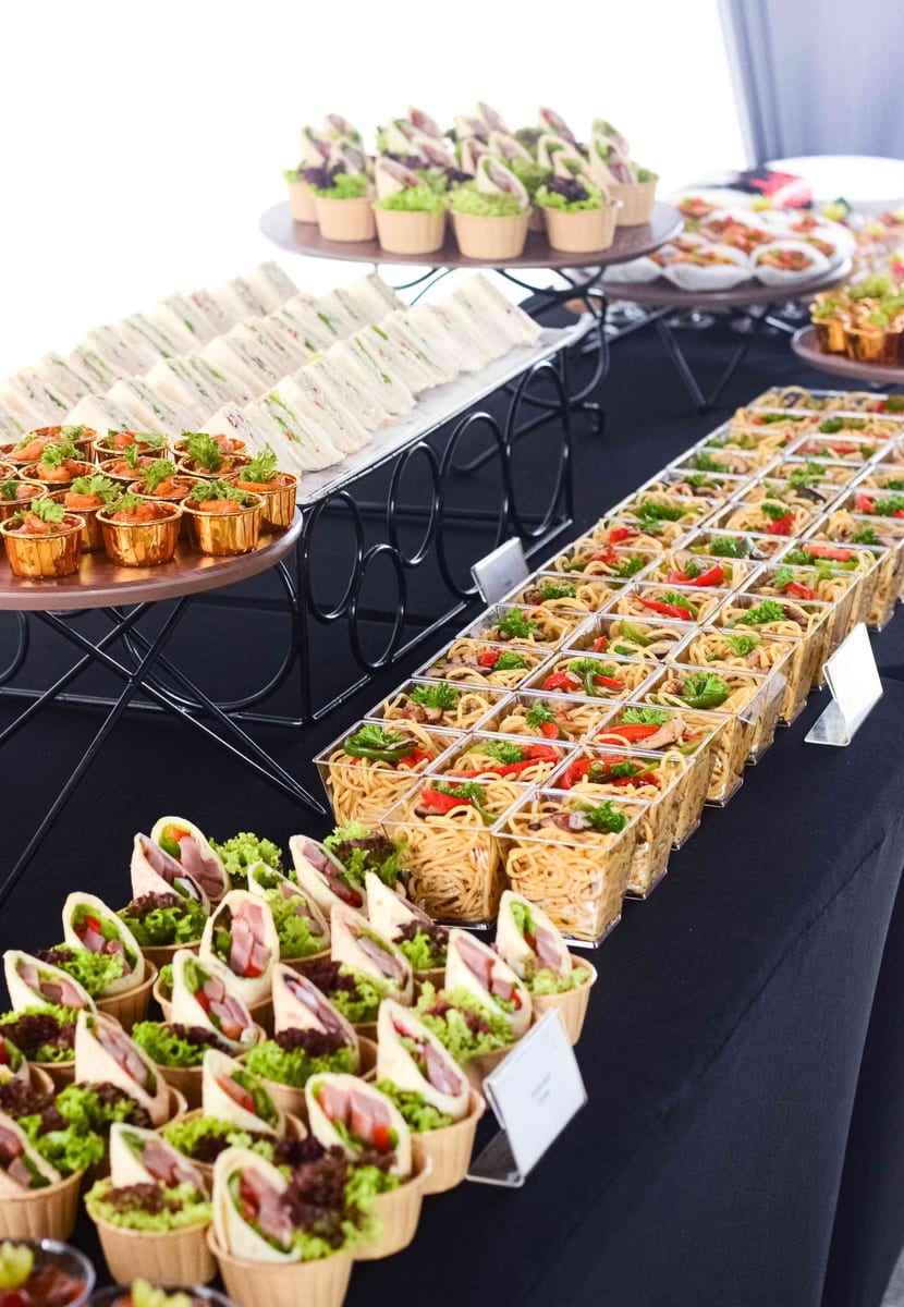 Smoke Duck Tortilla wraps and pasta in cups for a catering event by iDoCatering