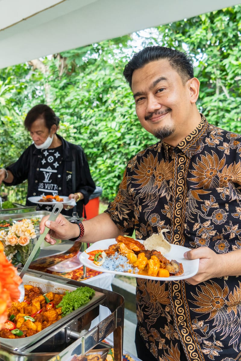 Guests happily choosing malay cuisines at buffet catering for malay wedding