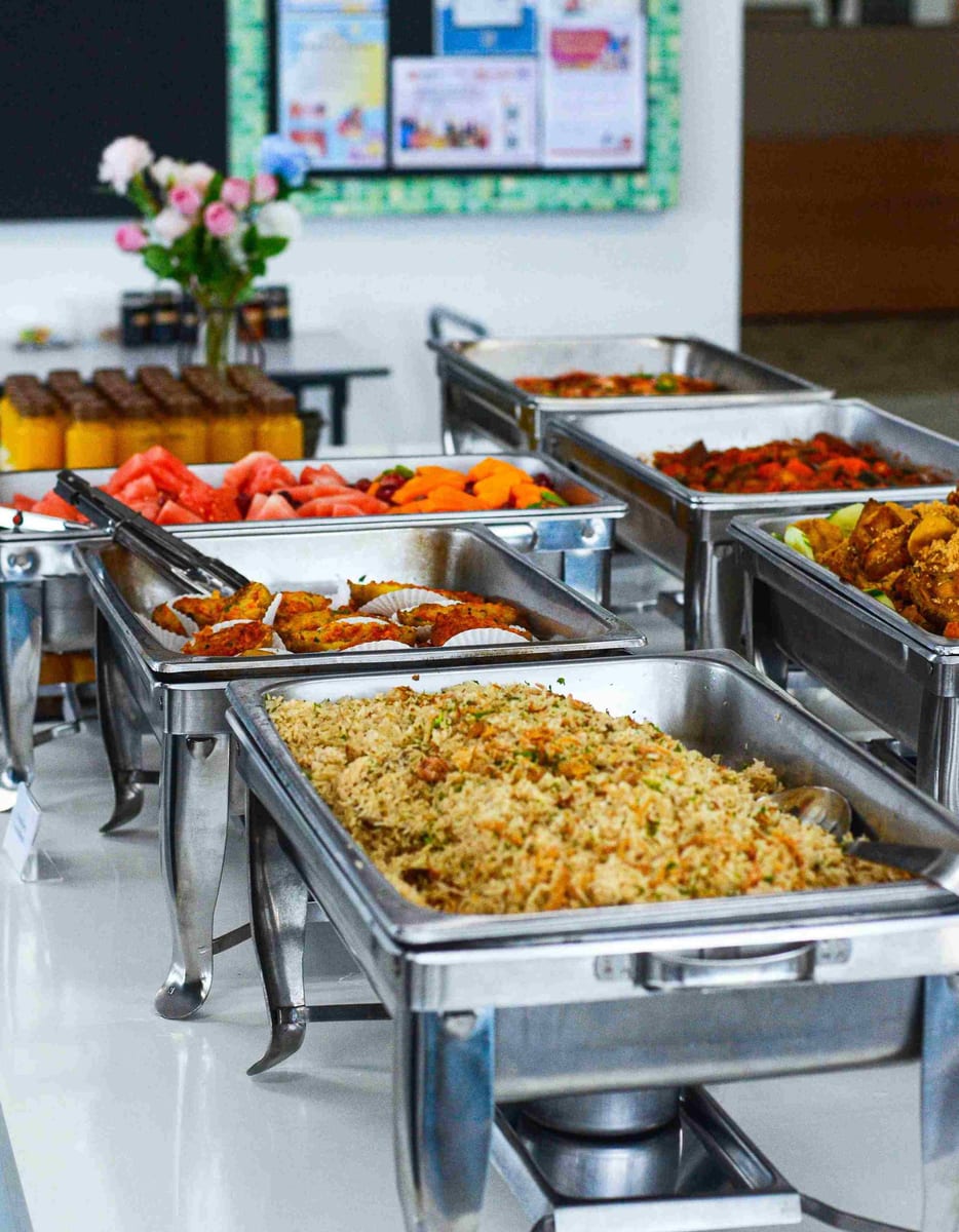 Office Buffet consisting of various cuisines served in silver trays by iDoCatering