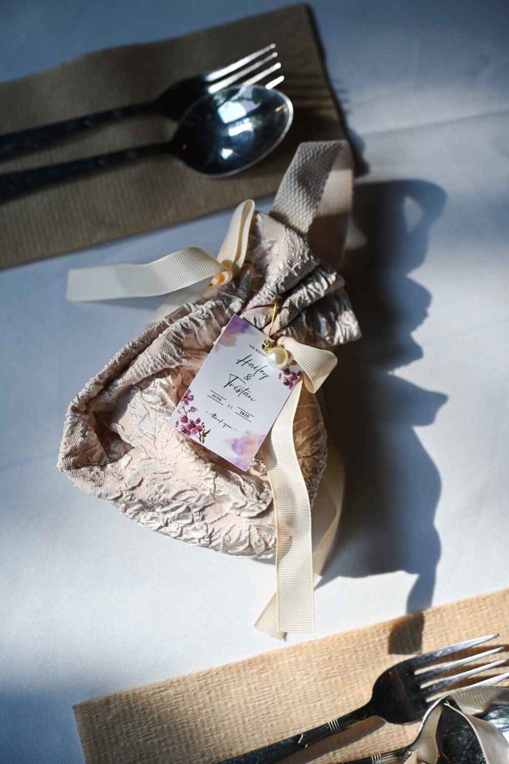 Wedding favour pouch with name tag at each place setting, ROM 8 Studio wedding catering 2025
