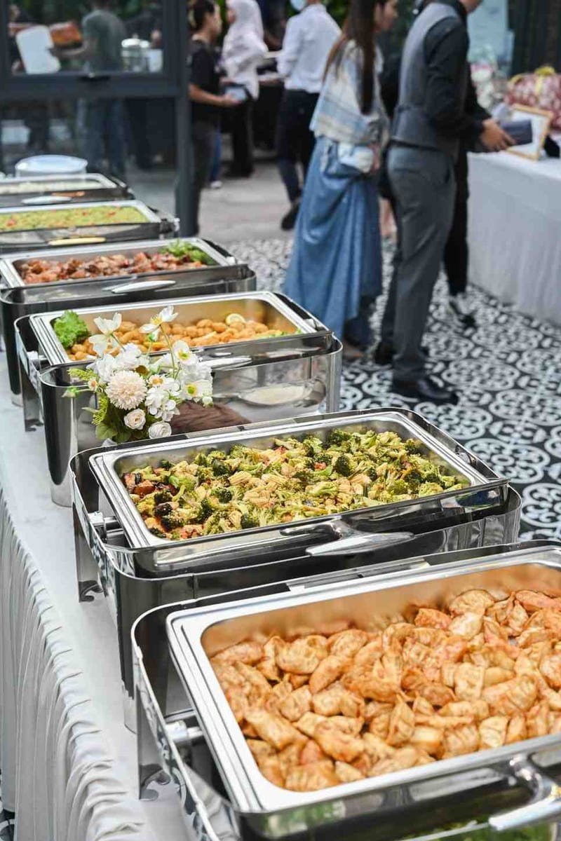 Wedding buffet line with fried dumplings and broccoli pasta at ROM 8 Studio by Metal Bees, by iDoCatering
