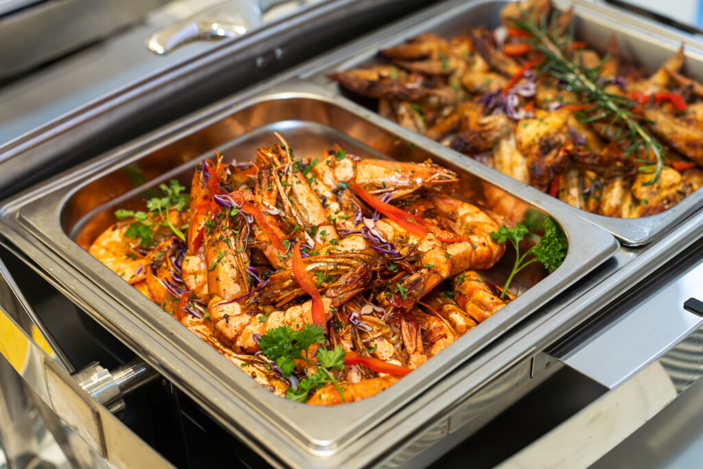 Big shrimp catering served on tray by iDoCatering for a wedding
