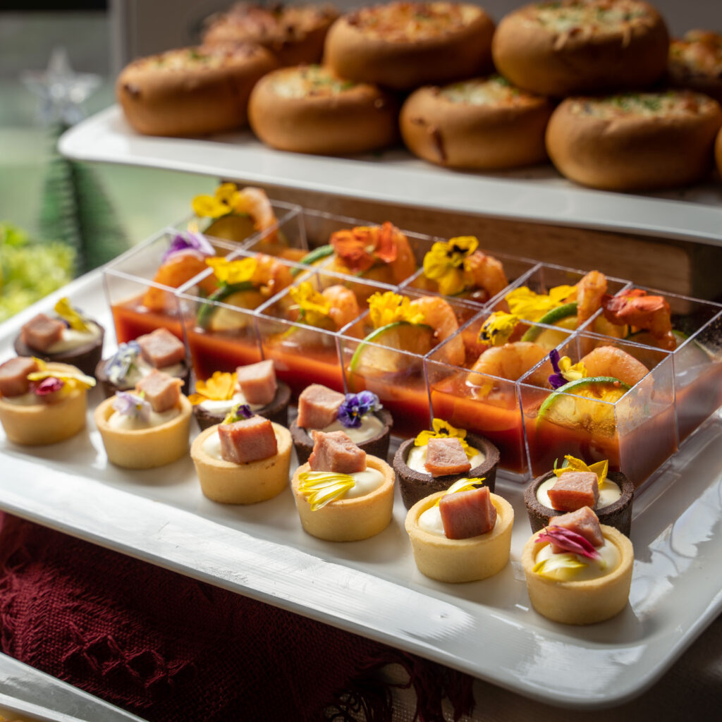 Ham tartlets with edible flowers and prawn cocktail shooters, iDoCatering Christmas 2023 catering