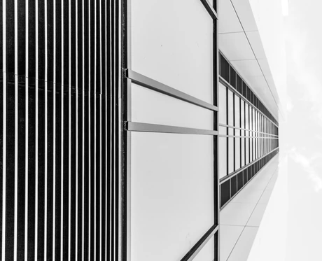 Vanta Archive — brutalist concrete architecture cut by a single acid-lime plane