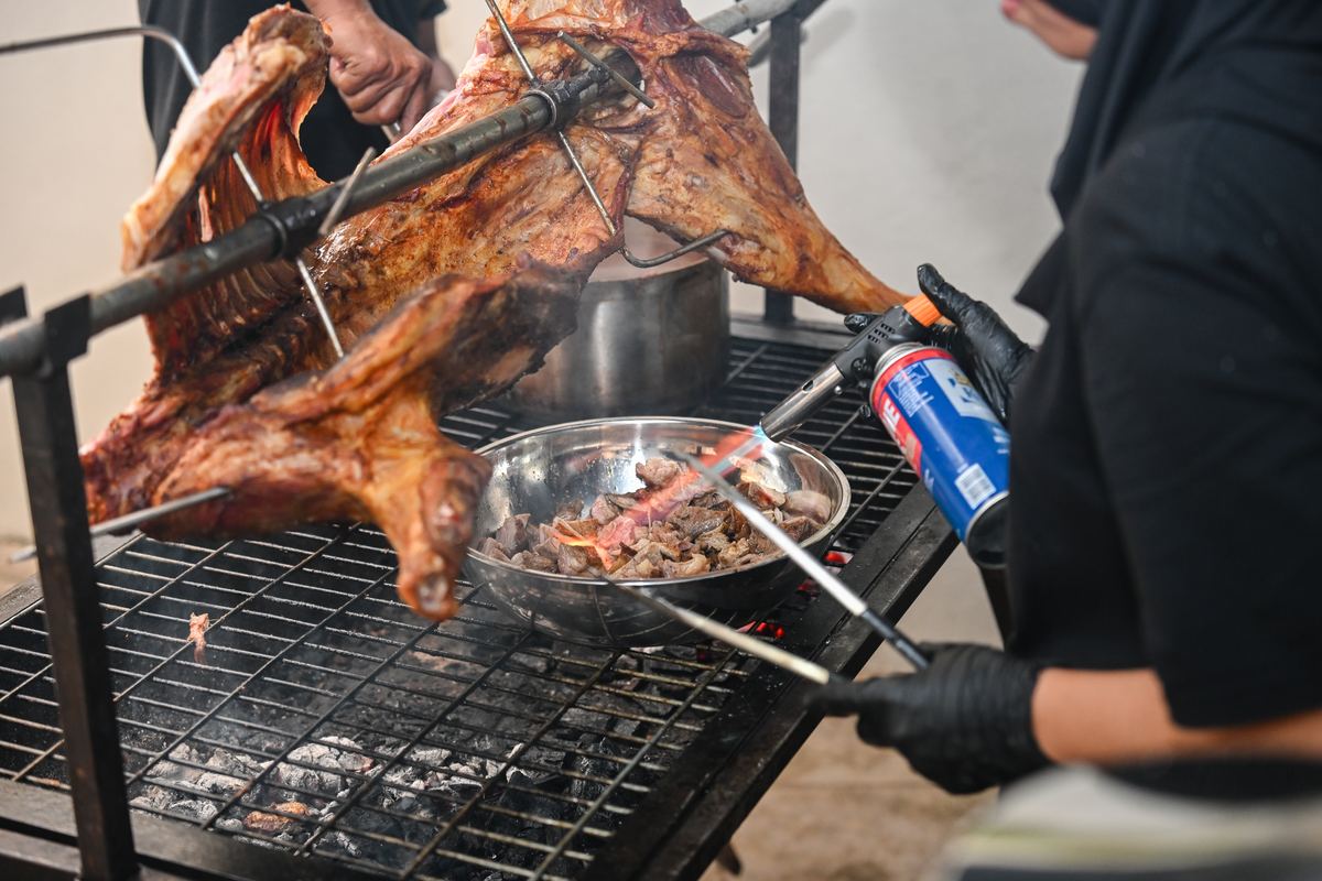 iDoCatering smoky grilled platter live station — whole roasted lamb on the grill at a small event KL