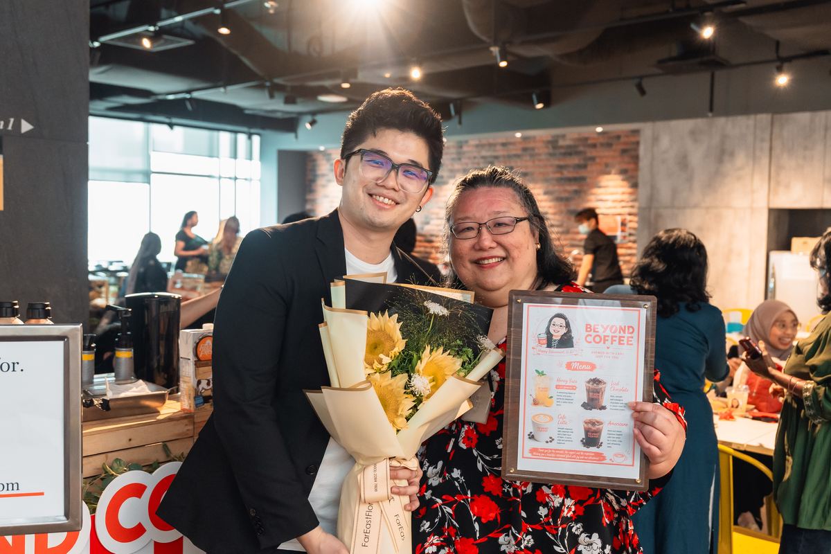 Lily with PwC Malaysia colleagues at her farewell celebration — iDo Catering corporate event Kuala Lumpur