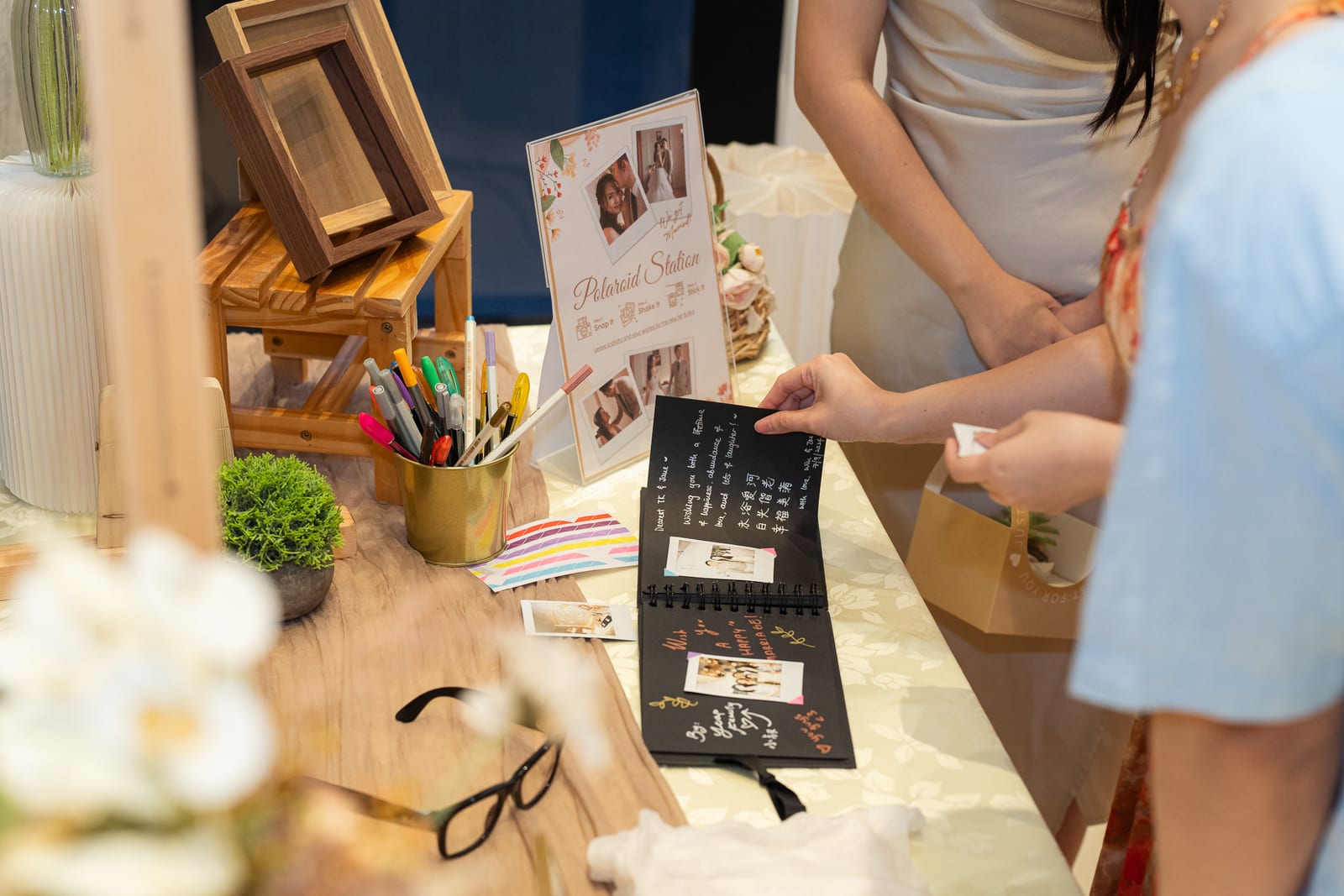 Polaroid and leave-a-message station at a wedding reception — iDoCatering wedding catering KL