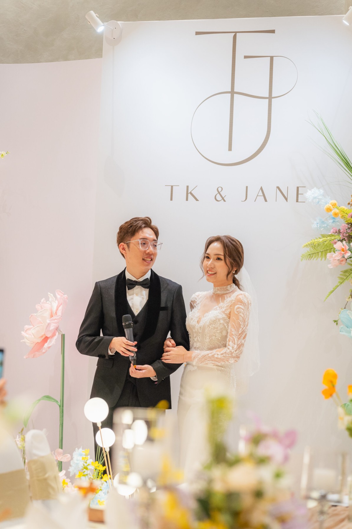 Bride and groom giving a speech at their KL wedding reception, catered by iDoCatering