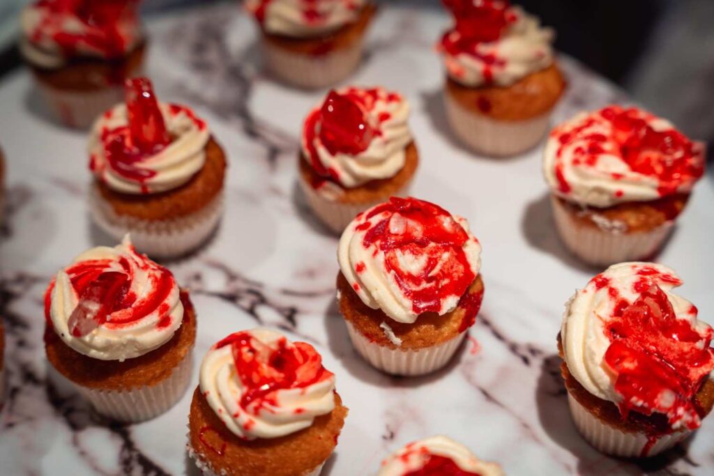 Blood-themed mini cupcakes with red jelly topping at the Paxtonz Halloween party, by iDoCatering