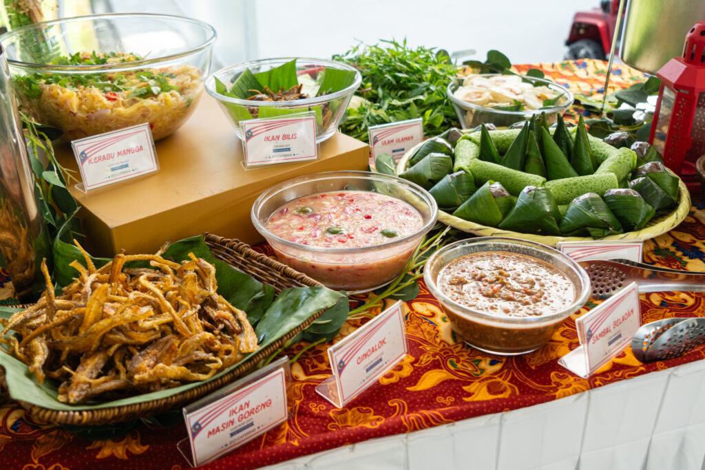 Labelled kerabu mangga, ulam-ulaman, cincalok, sambal belacan and ikan masin goreng at an iDoCatering Malay buffet