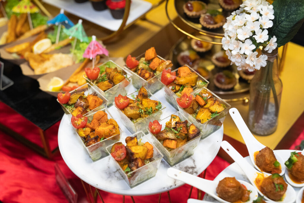 Pesto fusilli with roasted vegetables served in cups at an iDoCatering finger food party
