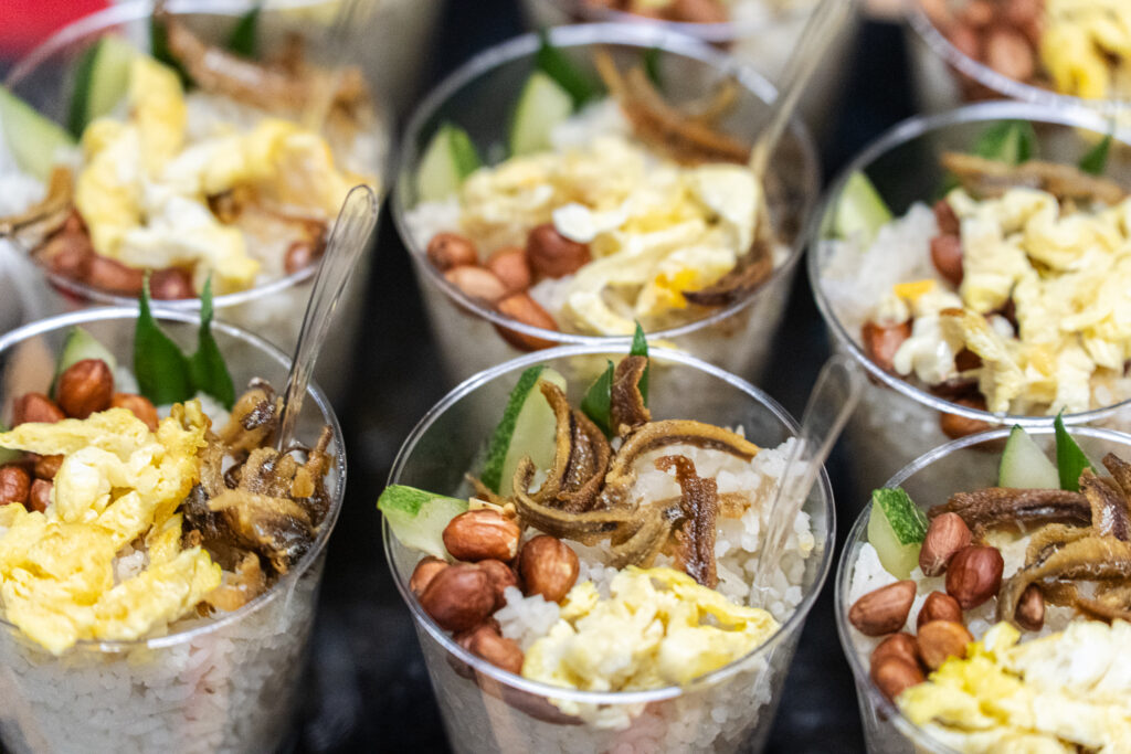 Nasi lemak served in individual cups with anchovies, peanuts and egg - iDoCatering canapé catering KL