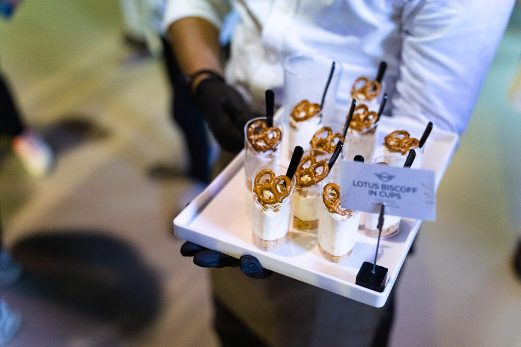 Lotus Biscoff dessert cups with pretzels on a tray for walk-around canapé catering at the MINI Cooper launch