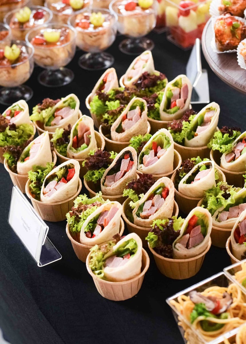 Smoked duck tortilla wraps with lettuce in paper cups, iDoCatering launch event canapés 2022