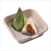 Kuih koci wrapped in banana leaf, one opened — iDoCatering seminar buffet