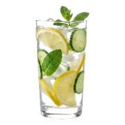 Tall glass of iced detox water with lemon and cucumber slices and mint — iDoCatering