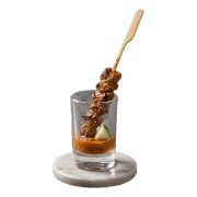 Chicken satay skewer served in a shot glass of peanut sauce — iDoCatering Malaysian canapé
