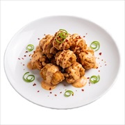 Japanese chicken karaage drizzled with spicy mayo and spring onion — iDoCatering buffet