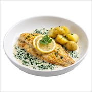 Fish fillet on creamed spinach with lemon and baby potatoes — iDoCatering buffet