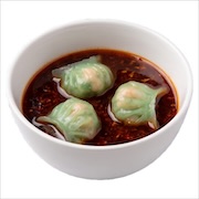 Three jade prawn dumplings in a bowl of red mala chilli broth — iDoCatering buffet