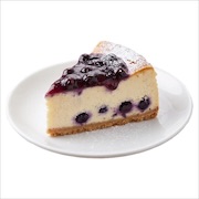 Slice of blueberry cheesecake with blueberry compote and icing sugar on a white plate — iDoCatering buffet