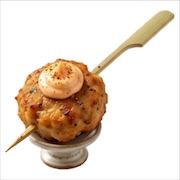 Japanese chicken karaage fritter with spicy mayo on a bamboo skewer, on a small footed stand — iDoCatering canapé