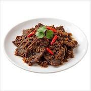 Daging dendeng, dry-fried sliced beef with chilli and coriander on a white plate — iDoCatering buffet