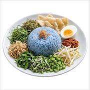 Nasi kerabu with blue butterfly-pea rice, herb salad, boiled egg, sambal and keropok — iDoCatering buffet