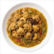 Ayam kurma, chicken in a mild yellow coconut curry with cashews, star anise and chilli — iDoCatering buffet