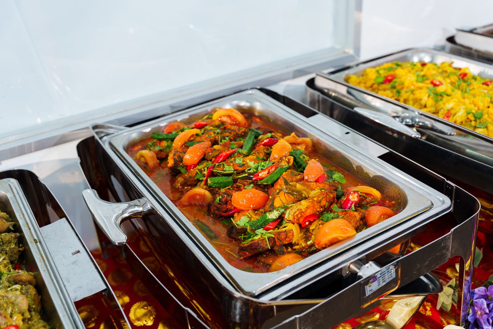 Goan lady finger curry fish with okra, tomato and red chilli in a chafing dish at an iDoCatering Deepavali buffet