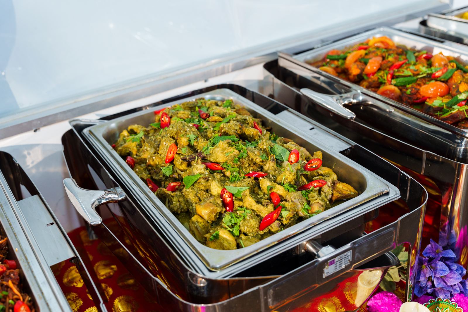 Nilgiri pudina chicken in green mint gravy with red chilli and coriander at a Deepavali buffet