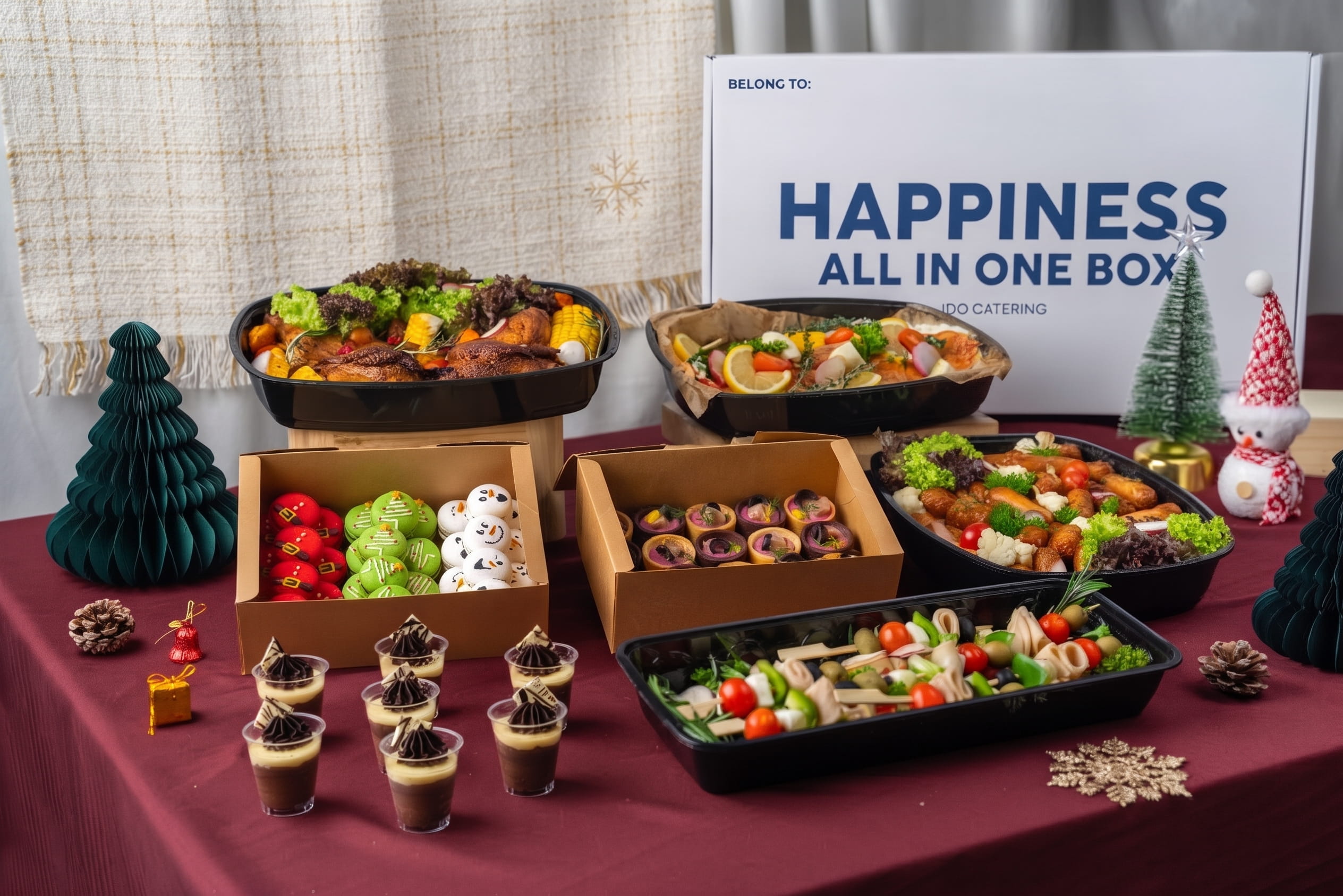 iDoCatering Christmas party box spread — roast chicken, seafood tray, pinwheel sandwiches, macarons and dessert cups