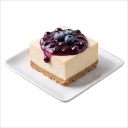 Chilled cheesecake slice on a biscuit base with blueberry compote and fresh blueberries — iDoCatering buffet
