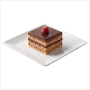 Raspberry opera cake, layered sponge with raspberry cream under chocolate glaze, topped with a raspberry — iDoCatering buffet