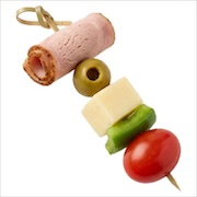 Antipasto skewer of rolled deli meat, green olive, cheese, green capsicum and cherry tomato — iDoCatering canapé
