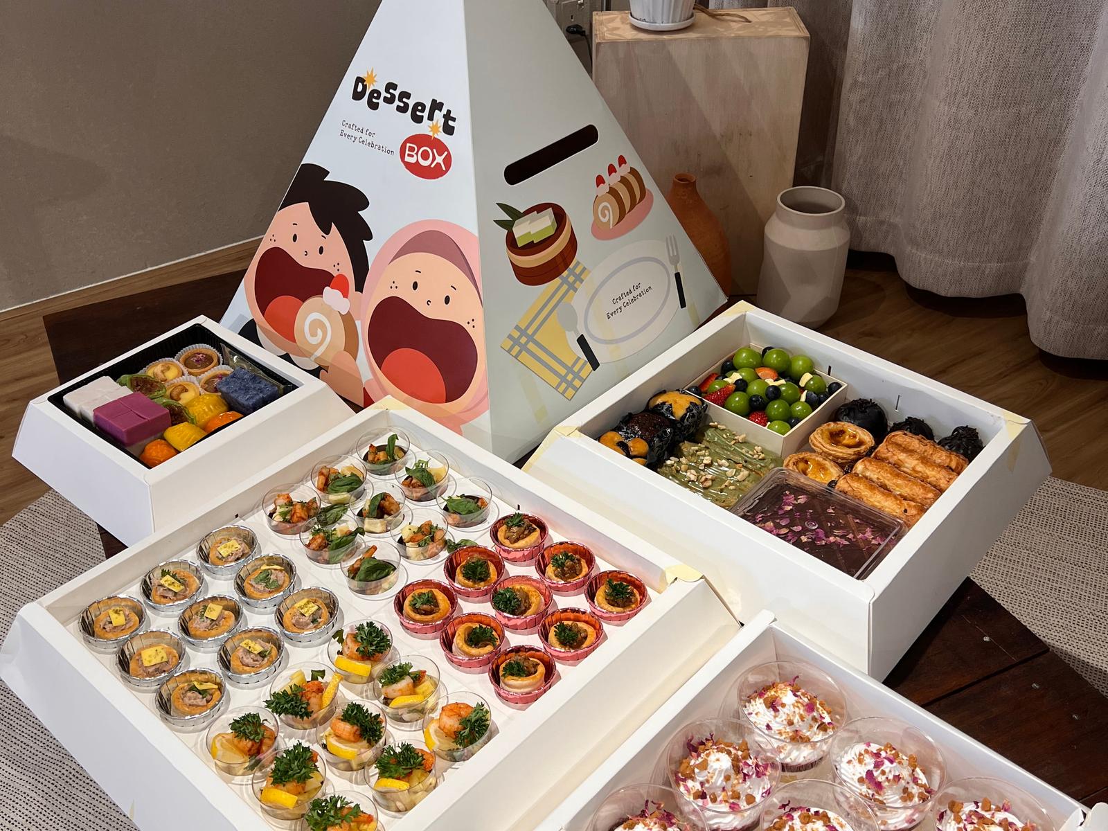 The Pyramid Dessert Box opened out: vol-au-vents, shrimp cups, Nyonya kuih, pastries and trifle cups — iDoCatering