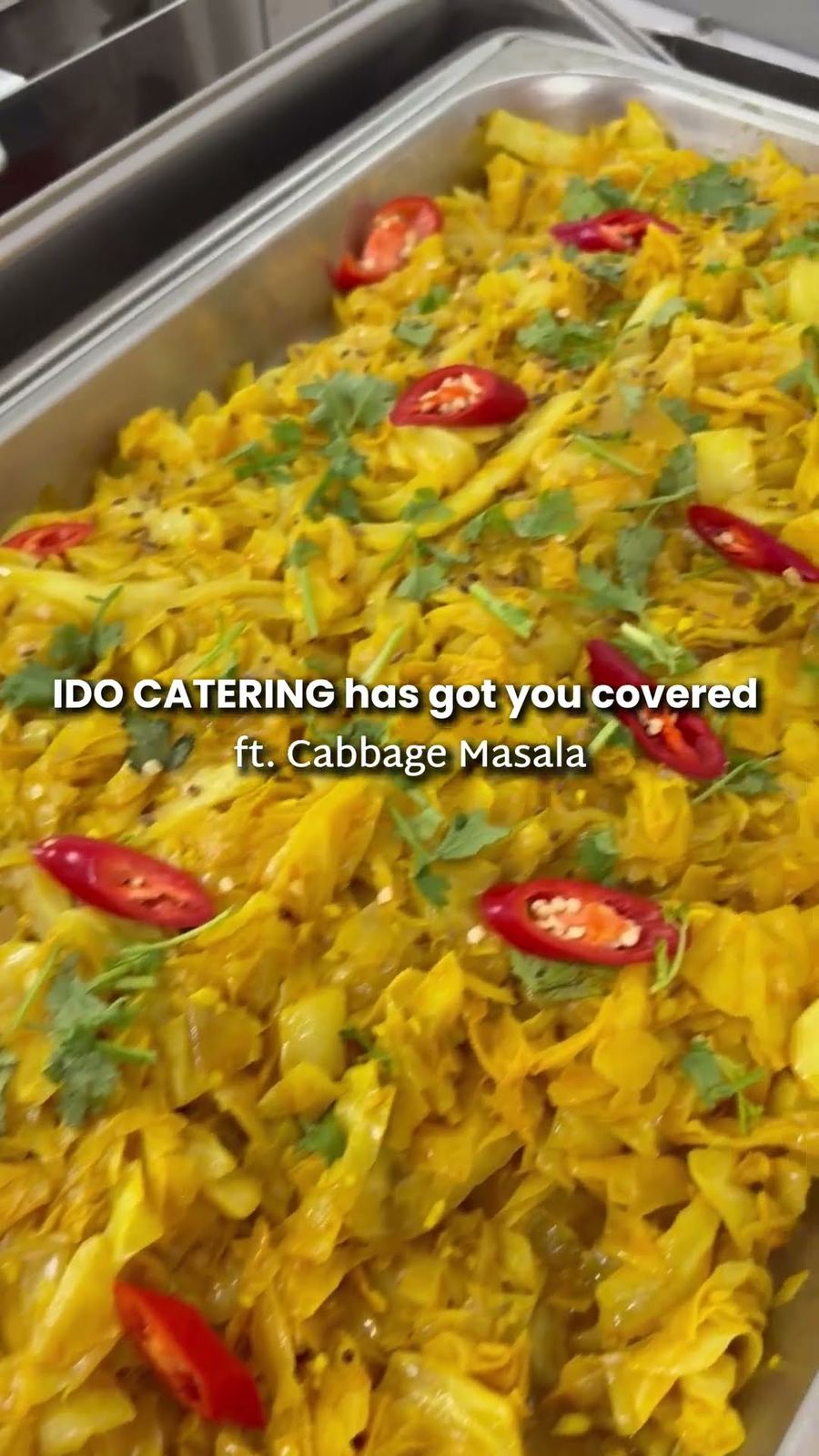 Cabbage masala with sliced red chillies and coriander in a chafing tray at an iDoCatering Deepavali buffet