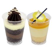 Chocolate indulgence cup with a chocolate shard beside a passion mango cup with a mango disc — iDoCatering