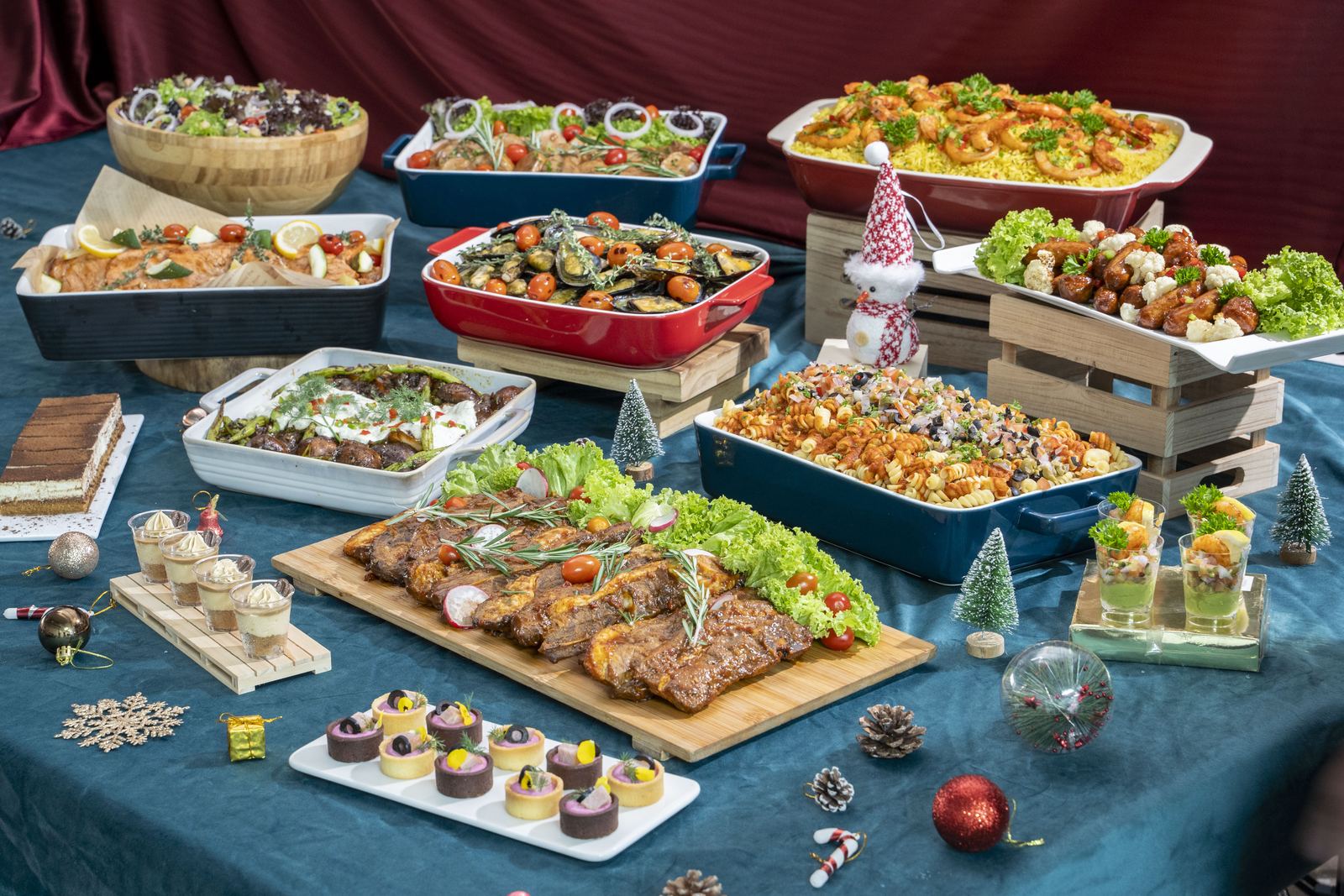 Christmas buffet spread of roast meats, seafood, pasta, salads and desserts — iDoCatering