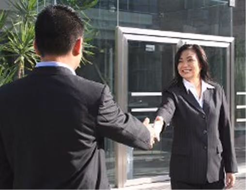 Business handshake outside office