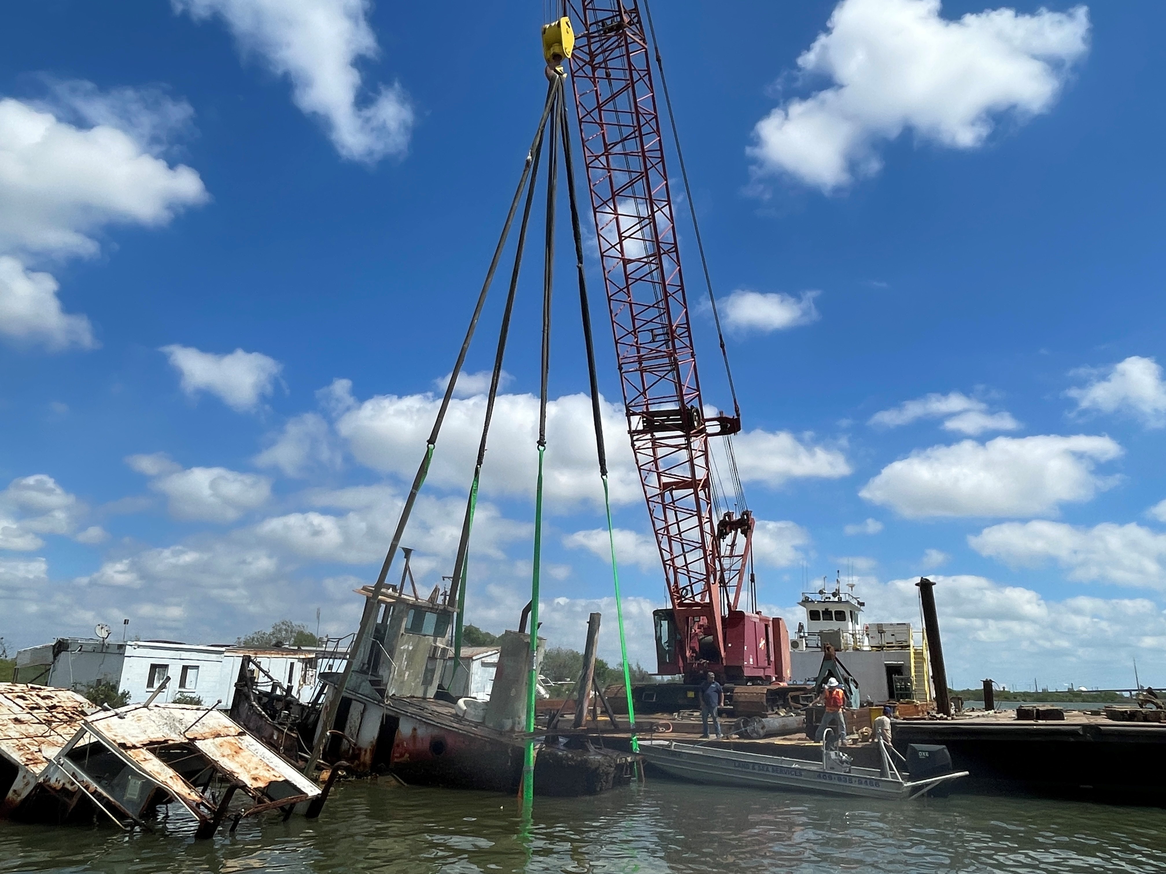 Crane barge recovering a sunken vessel