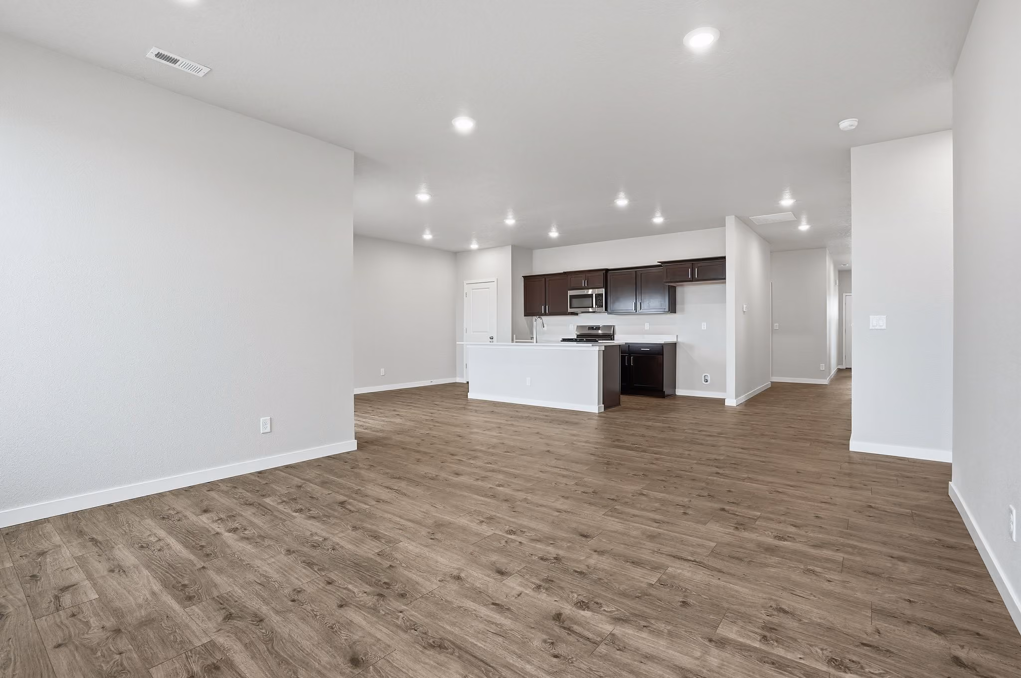 A staged great room with nine-foot ceilings in a home at Echelon Meadows.