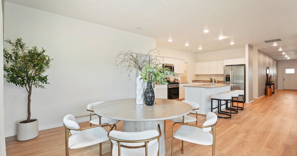 The dining area open to the kitchen in a home at Echelon Meadows in Deer Park, Washington.