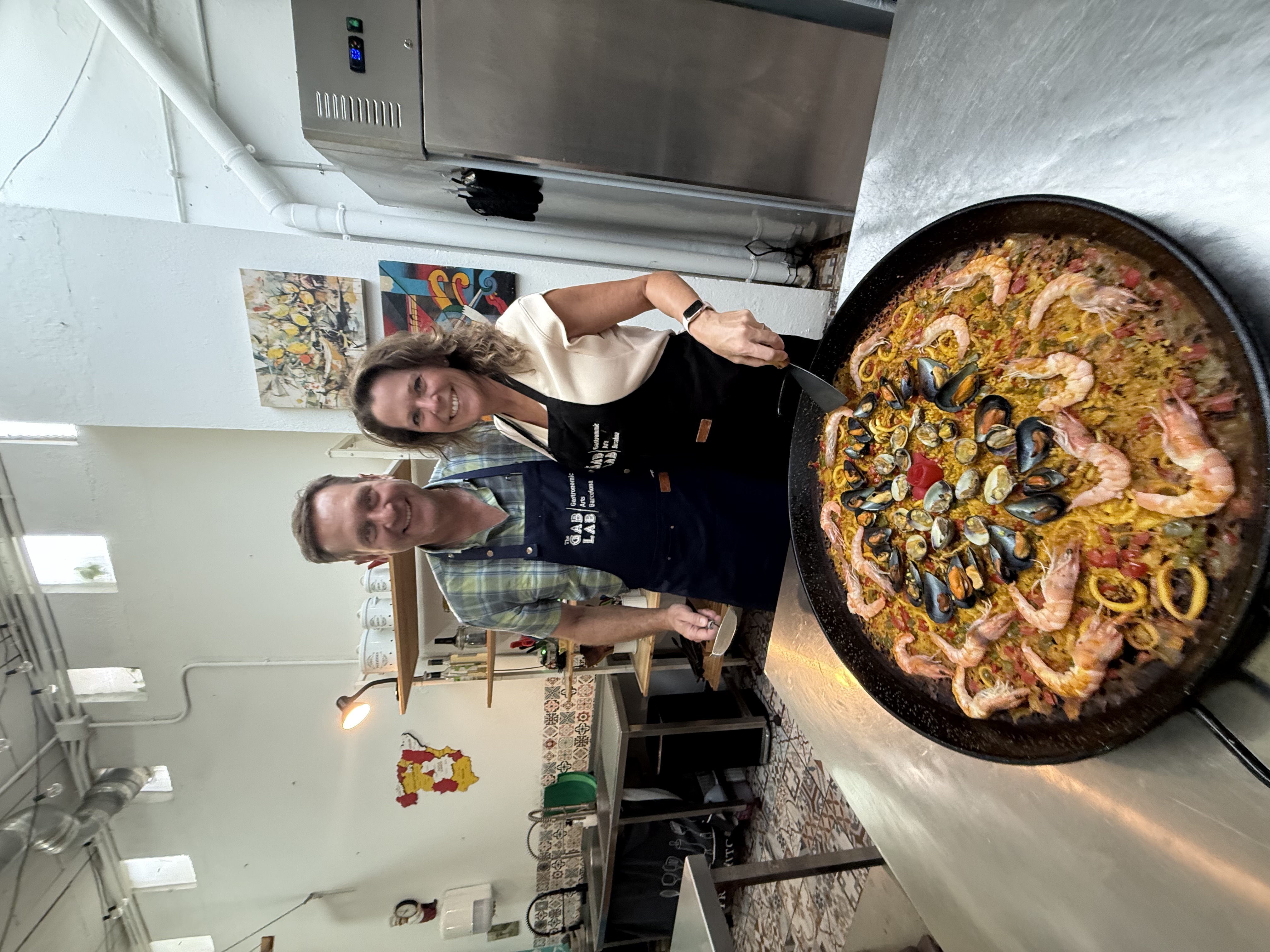 Michelle Braat and her husband making paella in Spain