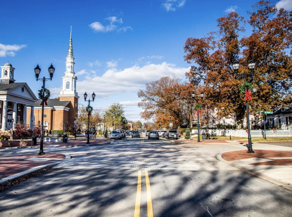 Downtown Cary streetscape with church, brick sidewalks and street lamps