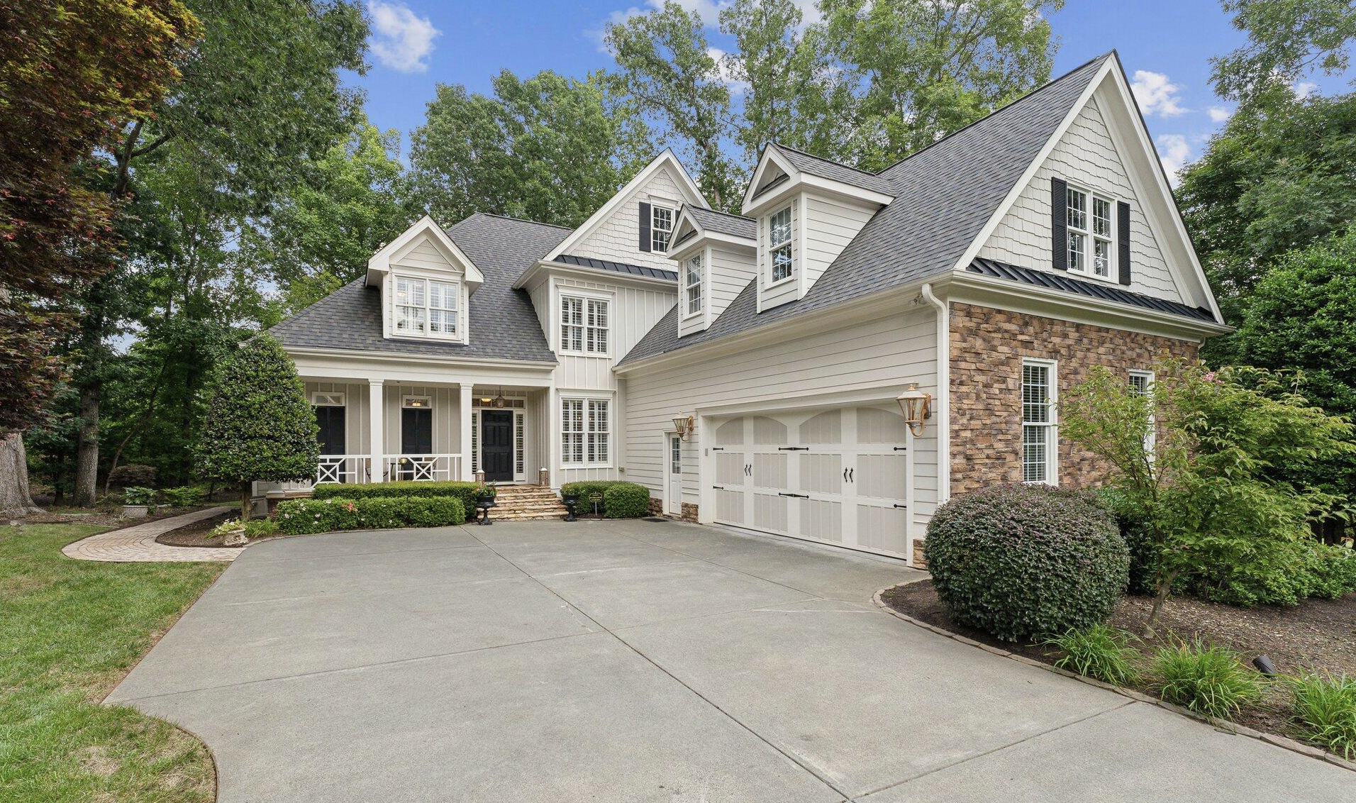 Traditional home surrounded by mature trees