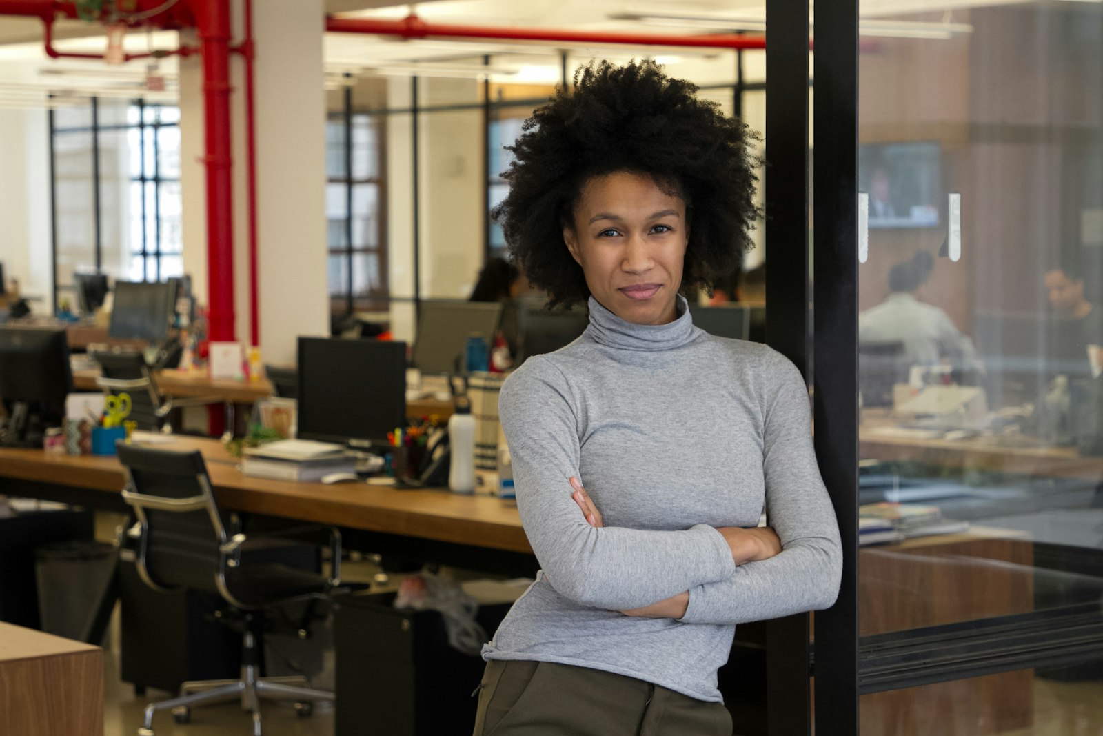 Senior leader standing confidently in an office