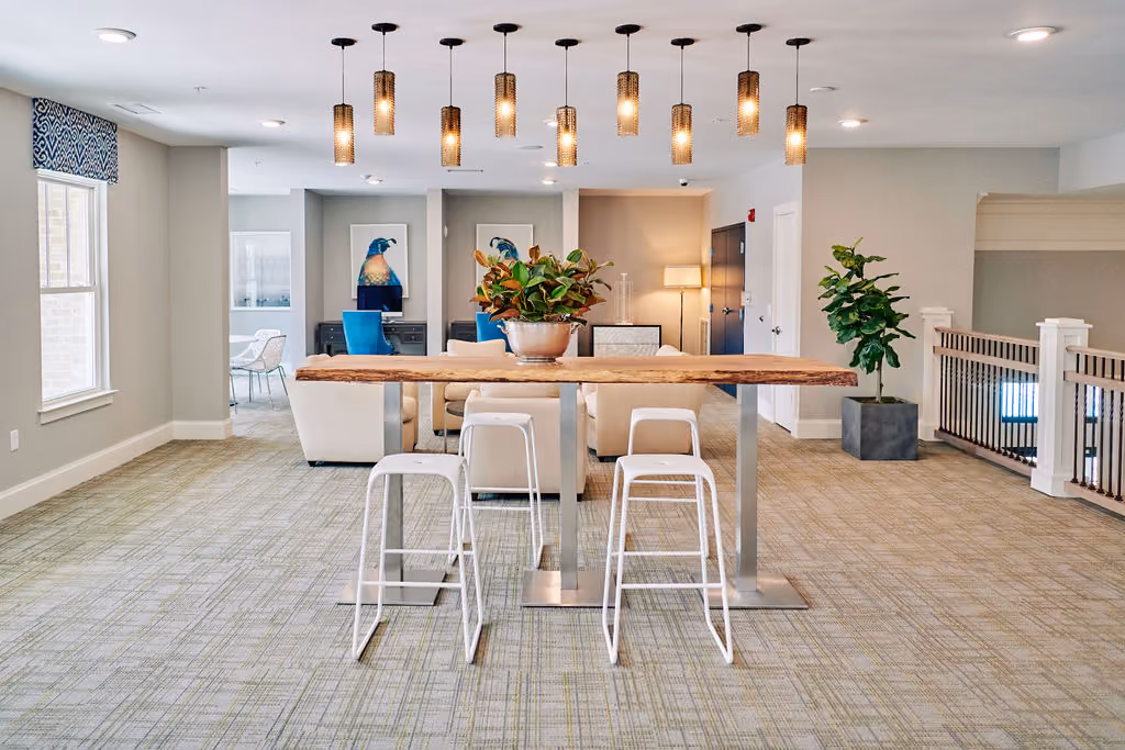 Modern kitchen and dining area with pendant lighting and bar seating