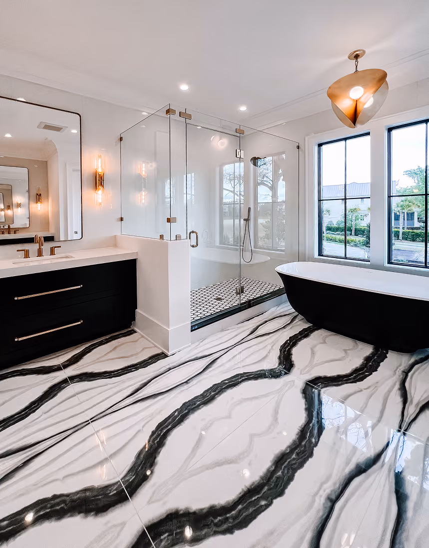 Bathroom with black-and-white marble-look tile flooring and a glass walk-in shower
